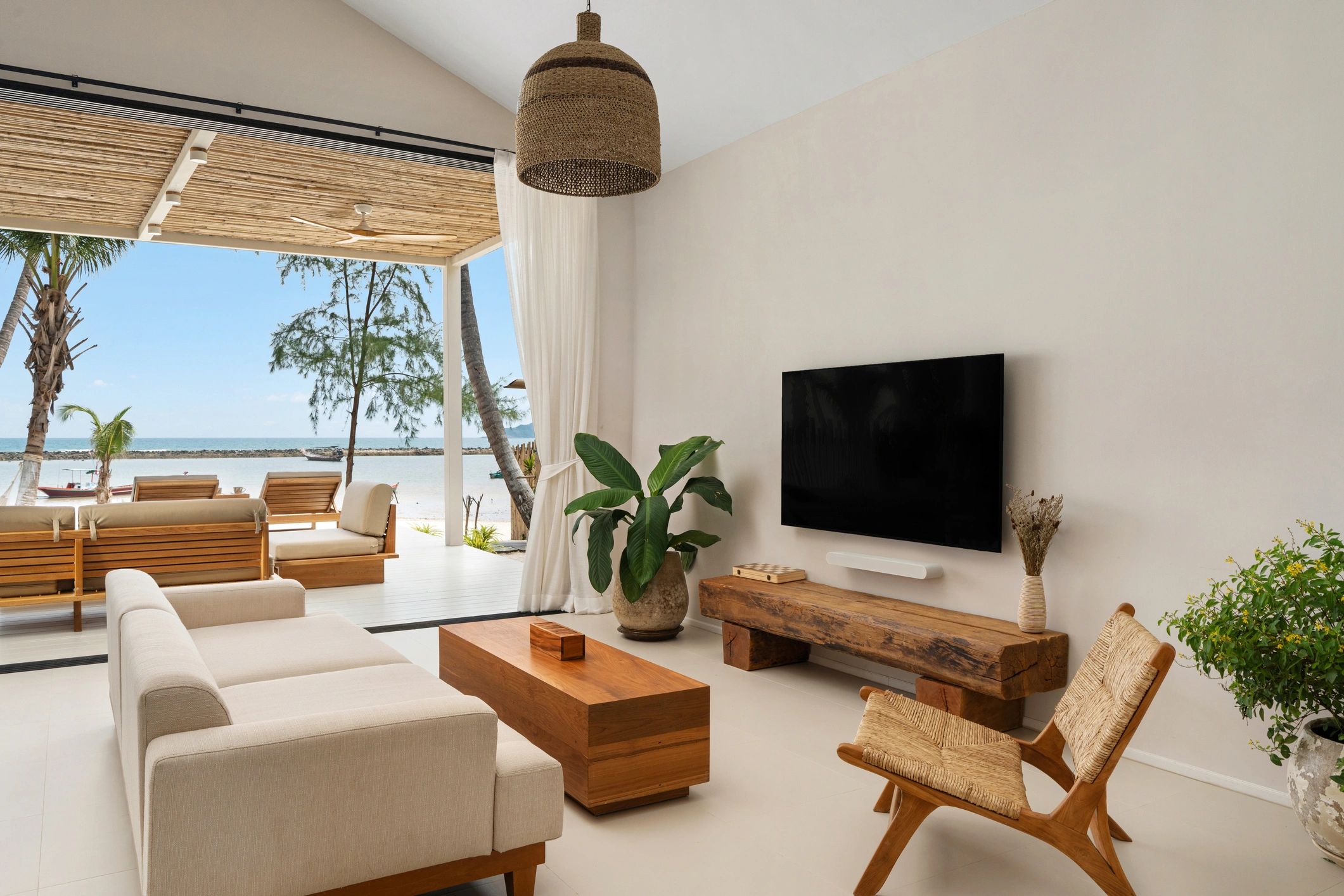 Modern luxury condo interior with ocean-view balcony